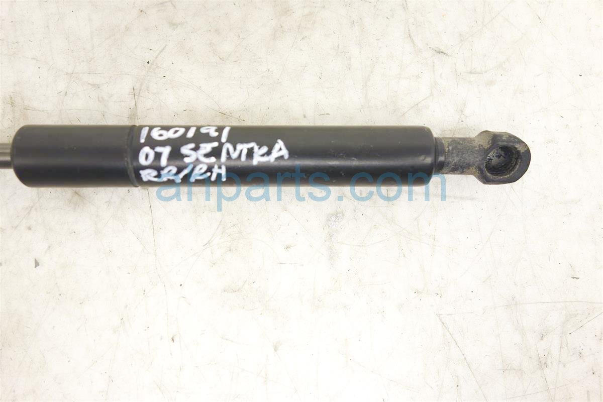 $10 Nissan LH TRUNK LIFT STRUT