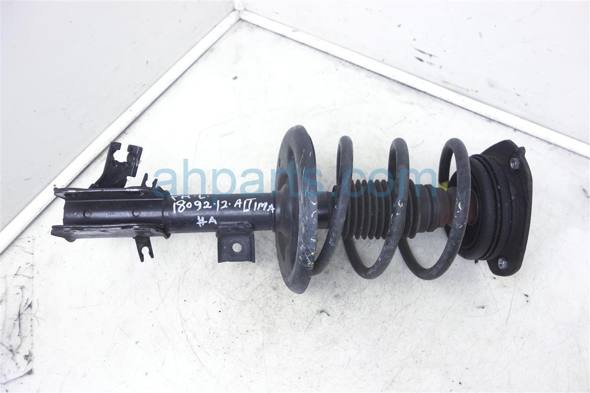 $59 Nissan FR/LH STRUT/SPRING -Aftermarket