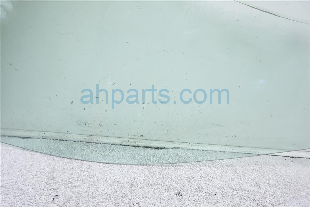 $30 Nissan FR/RH DOOR GLASS