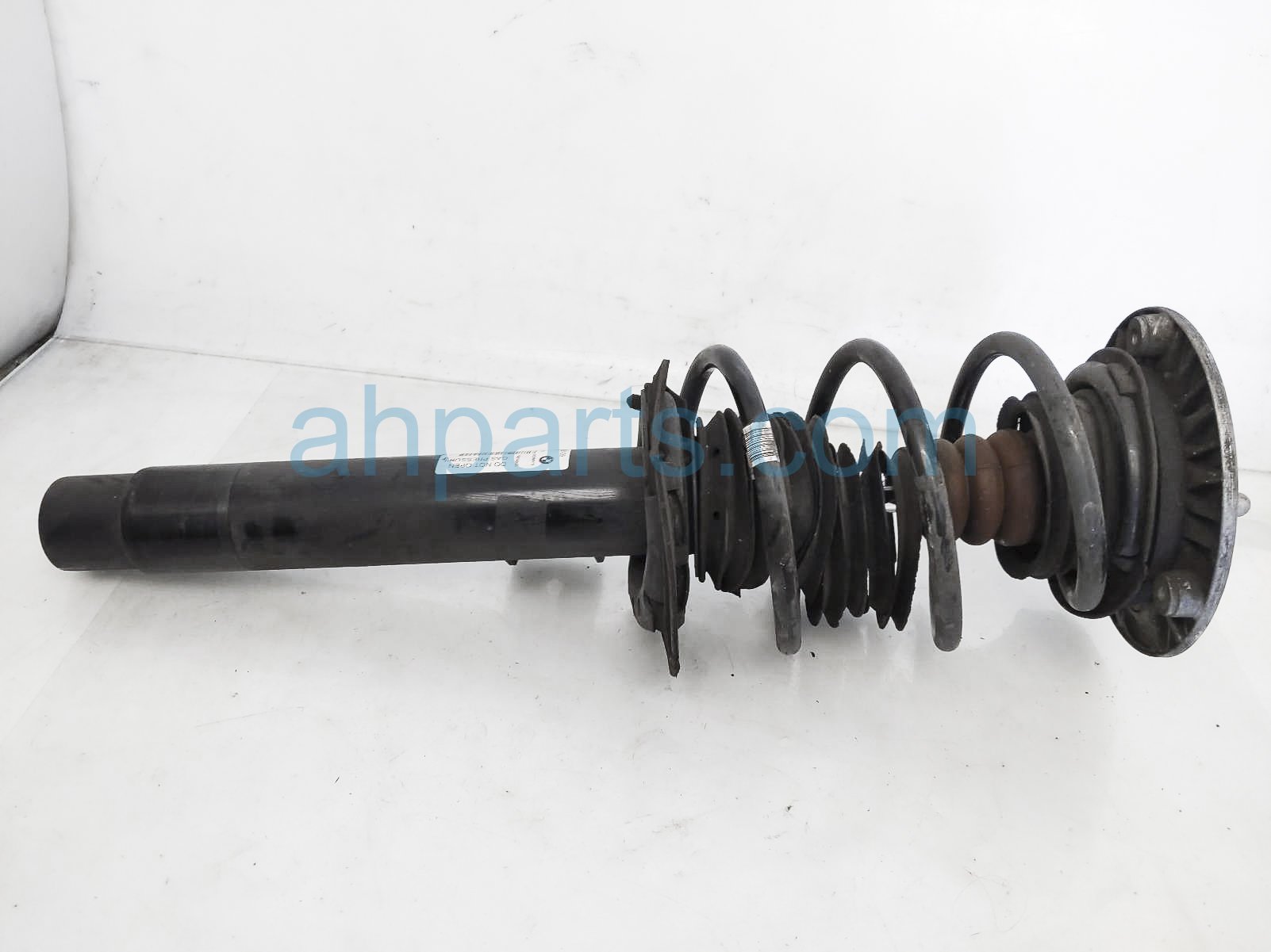 $125 BMW FR/LH SHOCK + STRUT