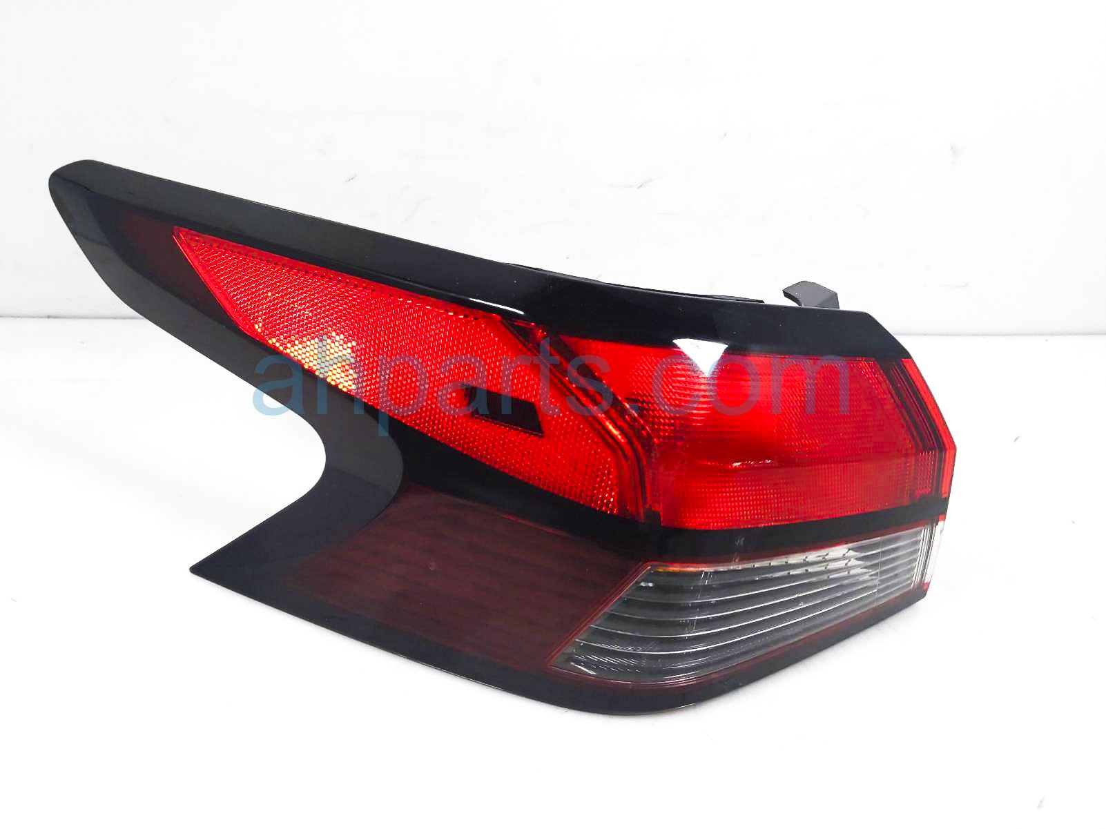 $149 Nissan LH TAIL LAMP (ON BODY)