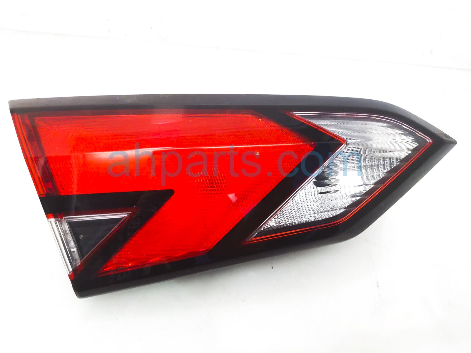 $100 Nissan LH TAIL LAMP / LIGHT ( ON GATE )