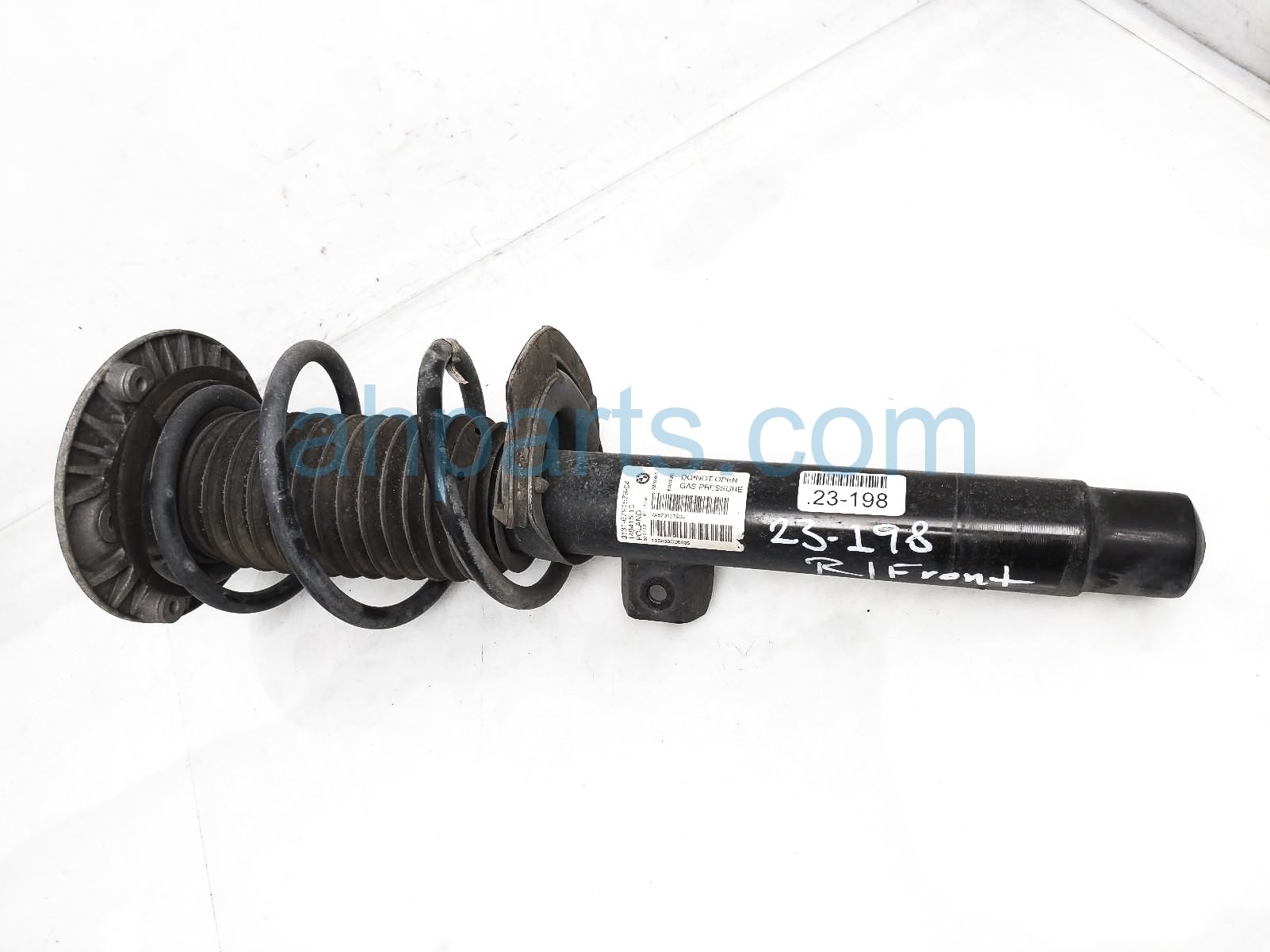 $125 BMW FR/RH STRUT + SPRING