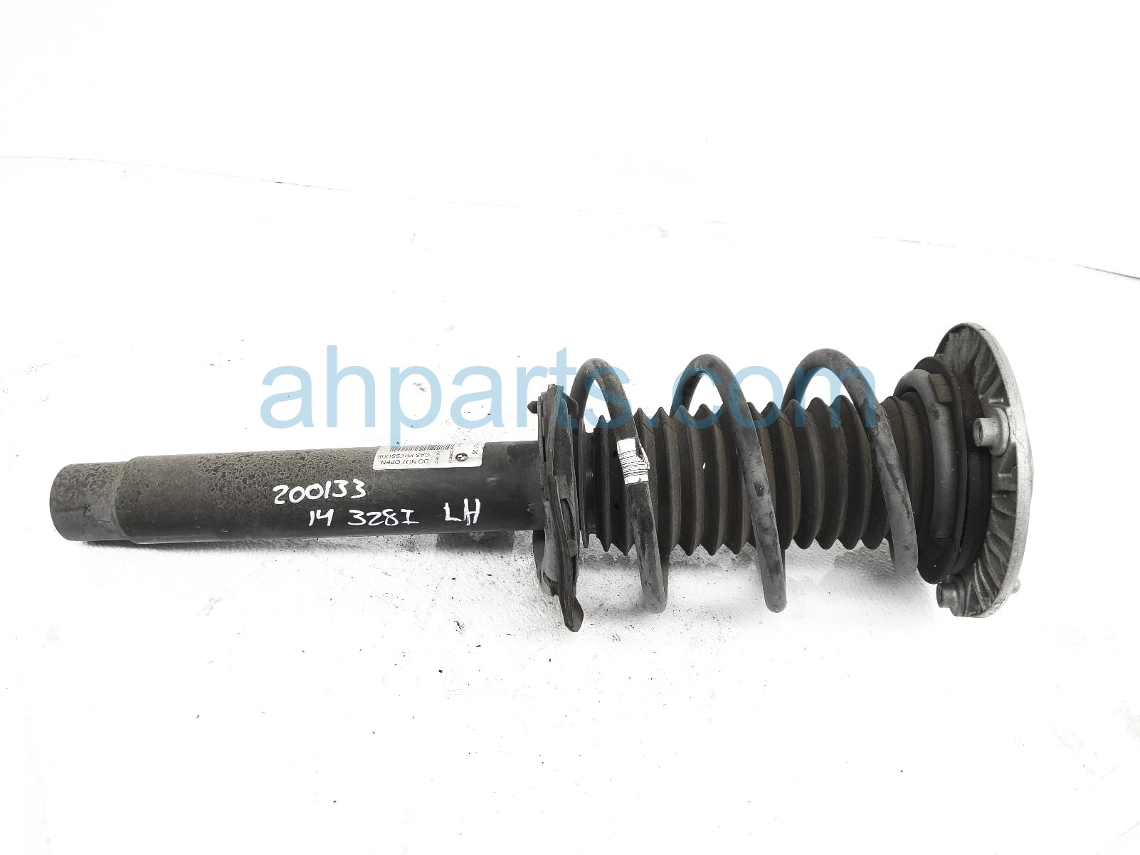 $125 BMW FR/LH STRUT + SPRING