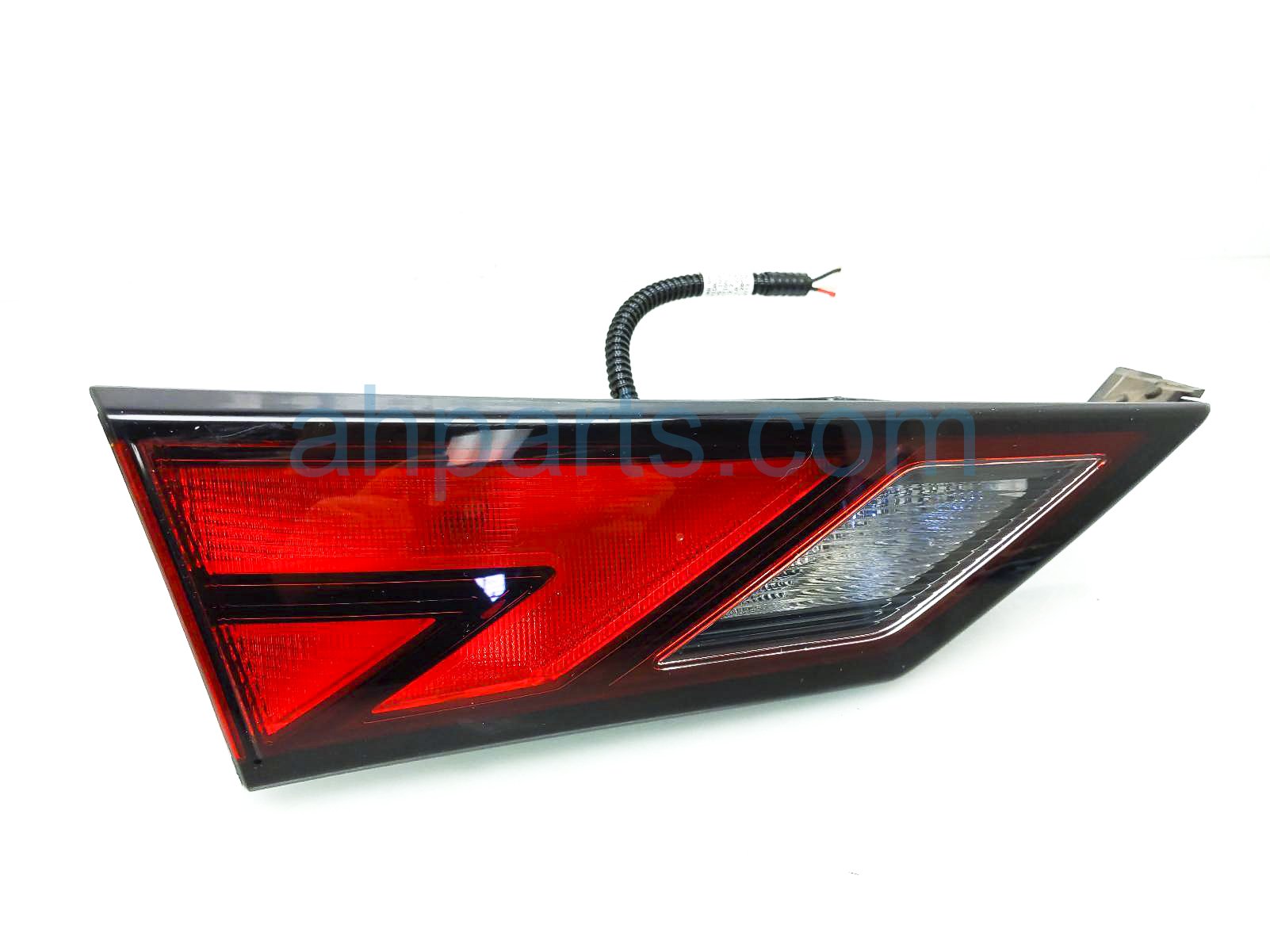 $99 Nissan LH TAIL LAMP (ON TRUNK)