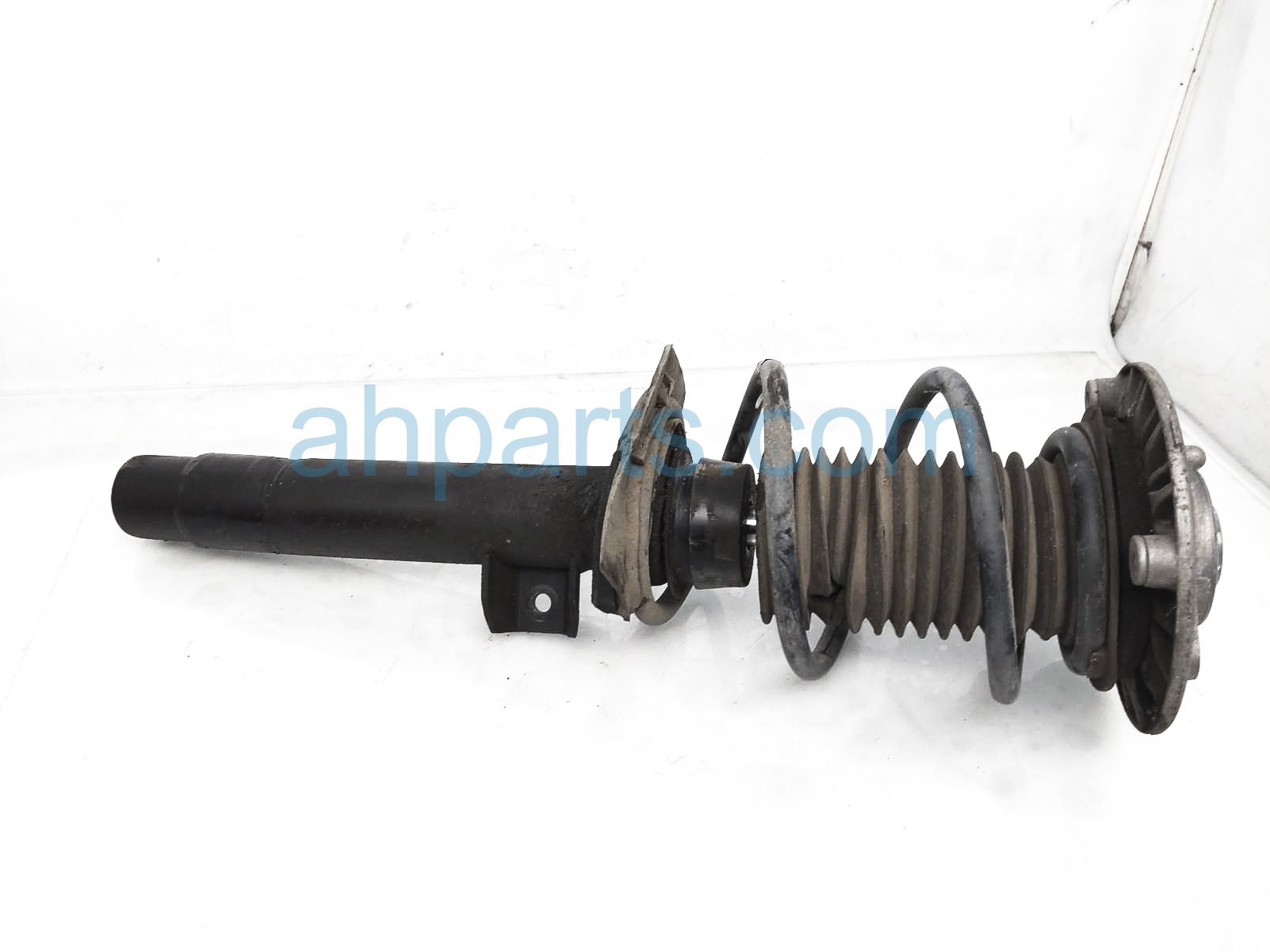 $125 BMW FR/LH STRUT + SPRING ASSY